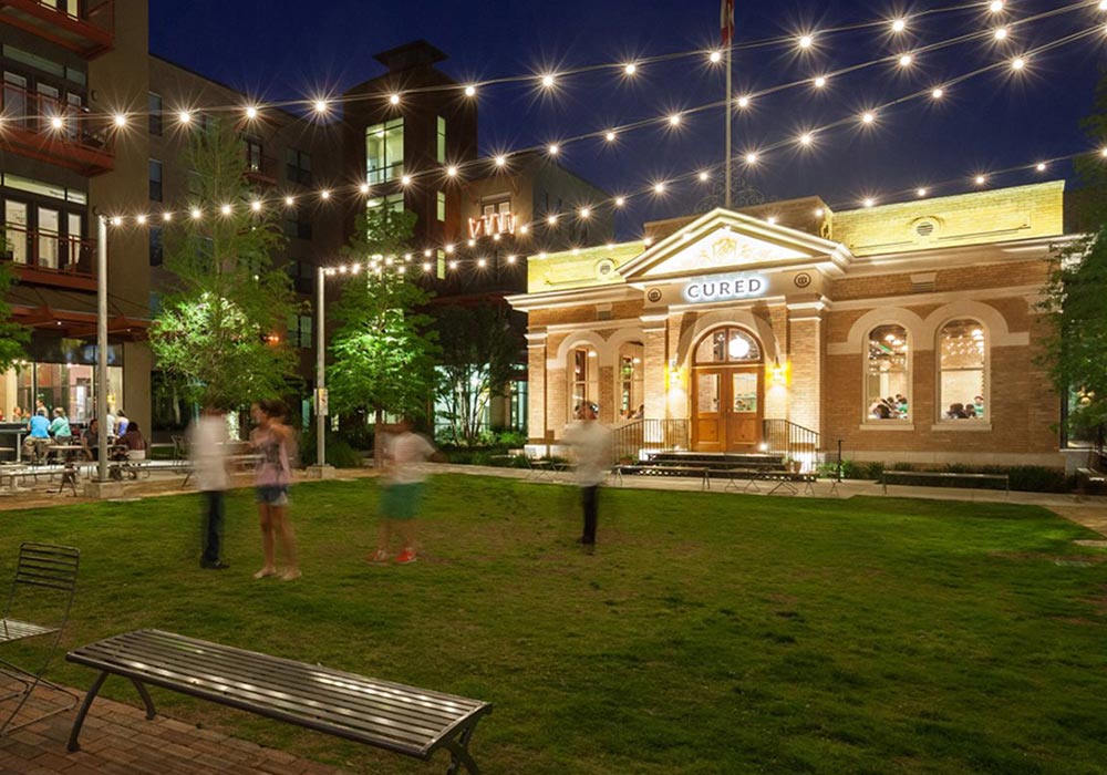 The Pearl with string lights illuminating the outdoor space designed by Saylee Greer landscape architecture company