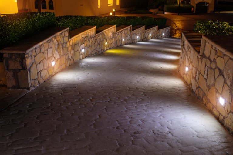 Beautifully lit pathway with LED lights, showcasing stunning Hardscapes design at night