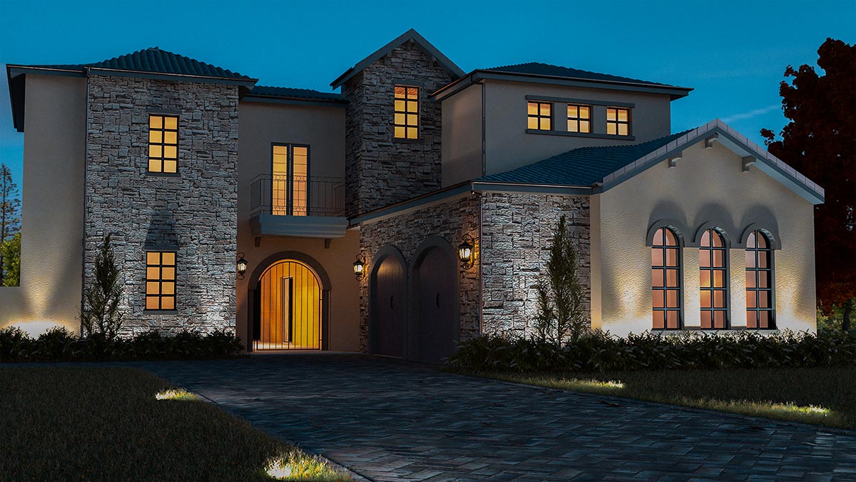 Stunning luxury home at night, showcasing elegant hardscapes and warm lighting that enhances its beauty