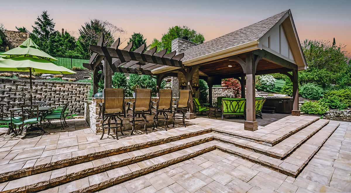 Cozy patio featuring a gazebo and chairs, showcasing beautiful hardscapes for relaxation