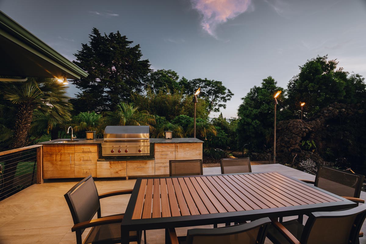 Cozy Outdoor Kitchens featuring a grill and table, perfect for gatherings and relaxation