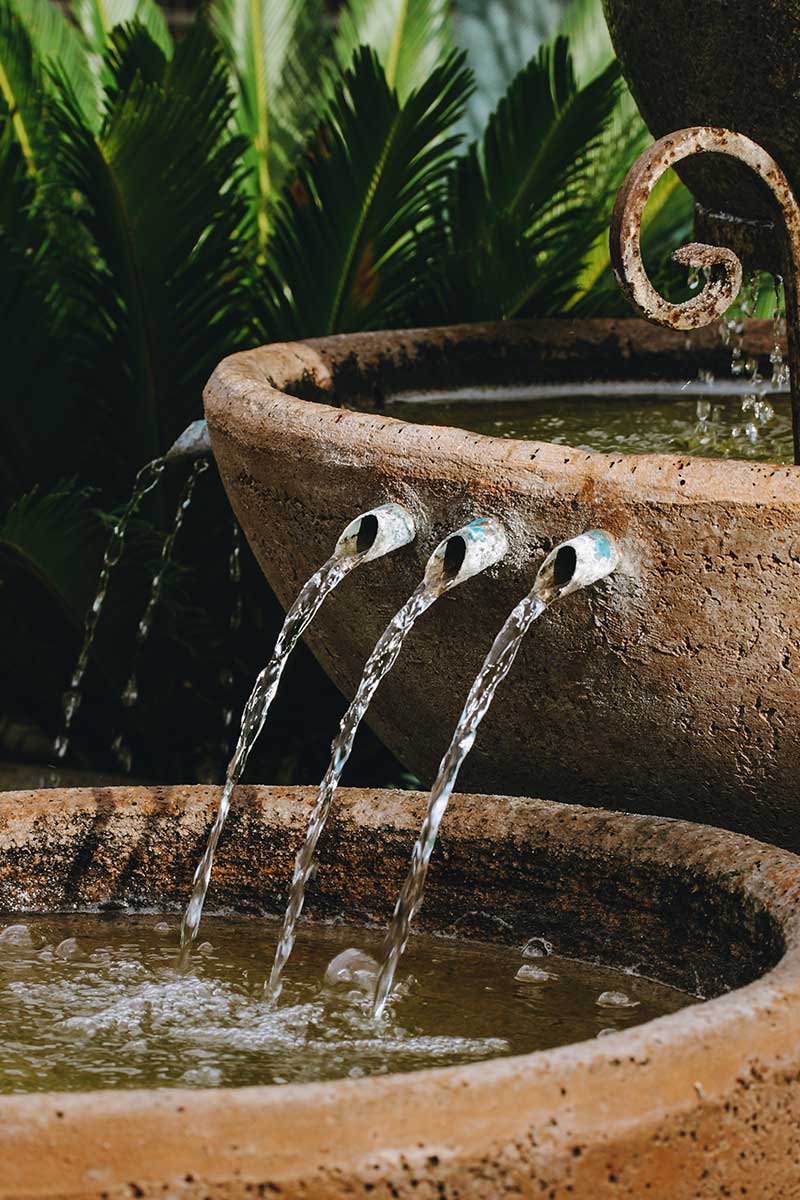 Close-up of a fountain showcasing beautiful water features as it flows gracefully from the spout