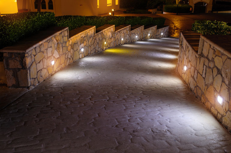 Beautifully lit pathway adorned with colorful LED lights, creating a magical nighttime ambiance