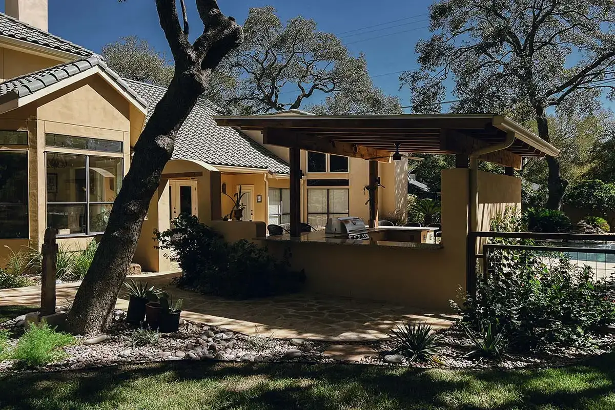 Cozy home featuring a covered patio, pool, and outdoor kitchens for relaxing and entertaining