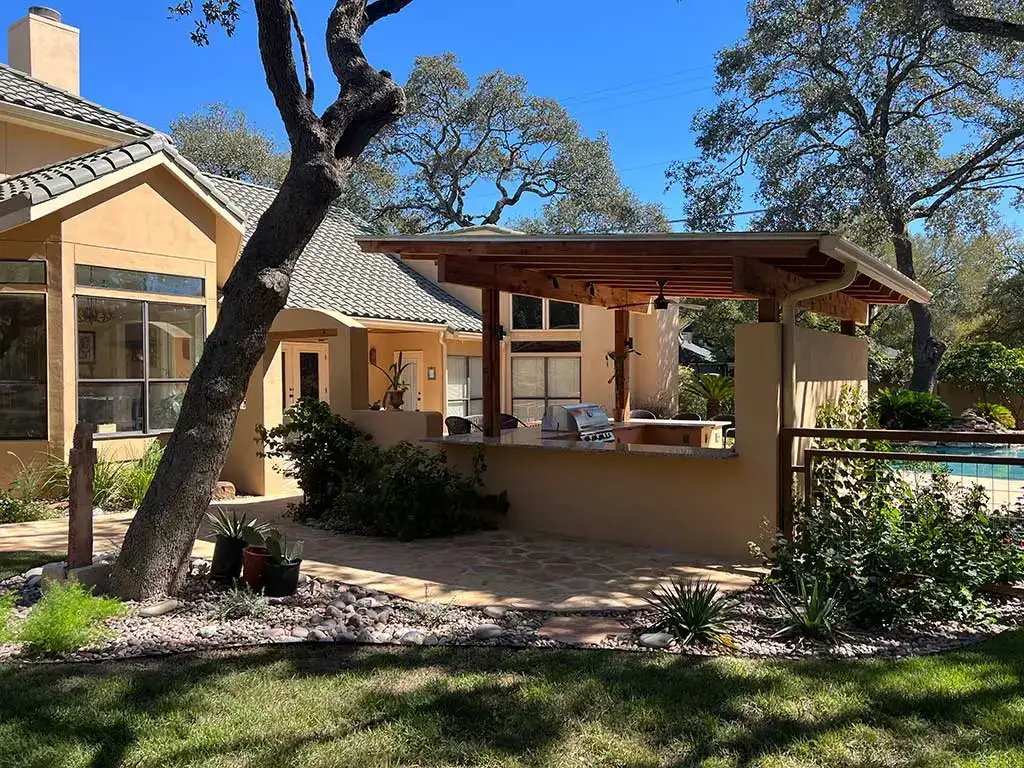 Cozy home featuring a covered patio, pool, and outdoor kitchens for relaxing and entertaining